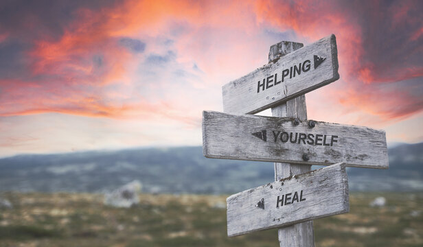 Signpost with words about healing, growth, and balance for counselling clients in Coquitlam